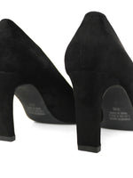 Detail of block heel on black pumps